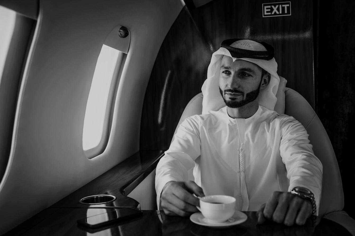 business-man-flying-on-private-jet-2025-03-16-09-11-56-utc-darken
